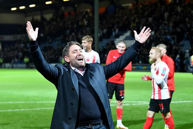 Sunderland boss Lee Johnson celebrates a cup win at QPR earlier this season