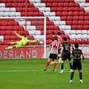 Cameron Jerome scores for MK Dons at the Stadium of Light