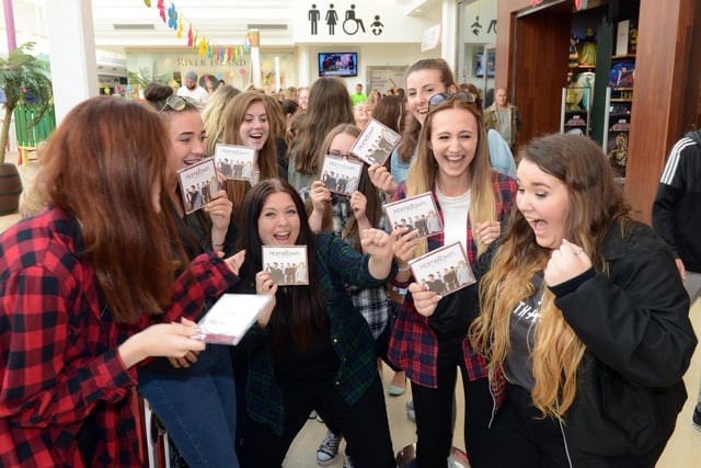 Fans of Hometown with copies of the band's CD at the HMV store in 2015. Recognise anyone?