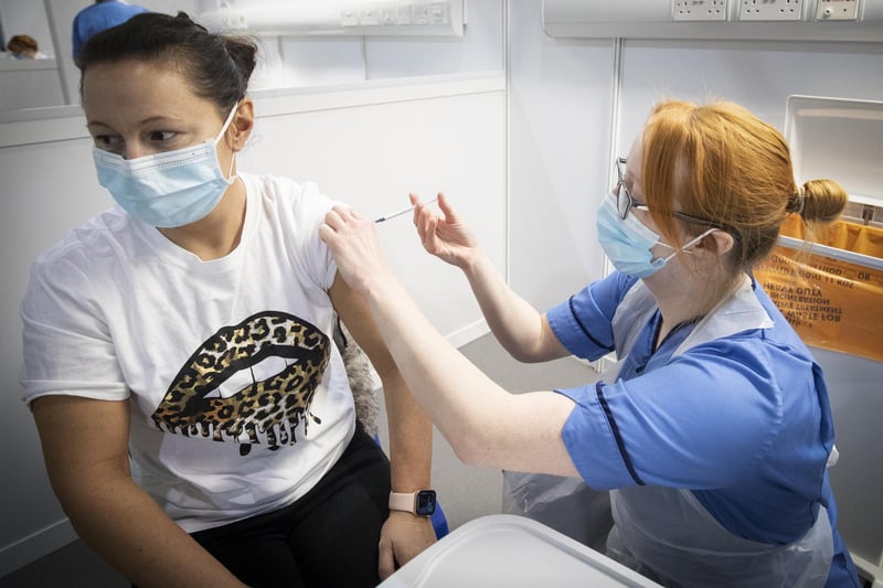 Nurse Eleanor Pinkerton administers a coronavirus vaccine to one of the health and social care staff at the NHS Louisa Jordan Hospital in Glasgow in January.