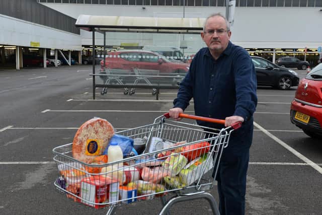 Kevin Clark with his trolley containing £30's shopping