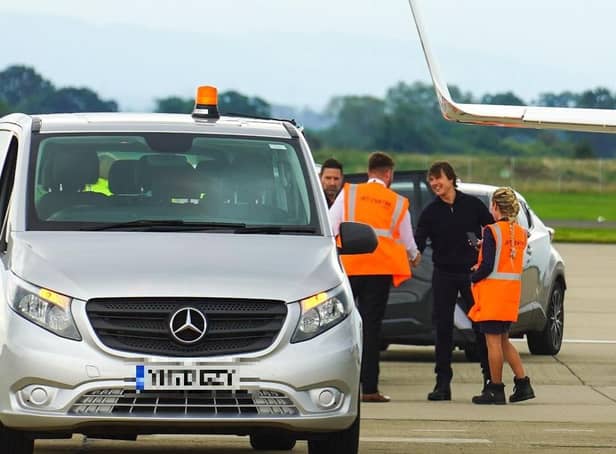 Actor Tom Cruise is greeted after touching down at Teesside International Airport.