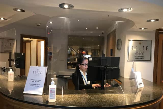 Reception staff behind screens at The Grand in Seaburn