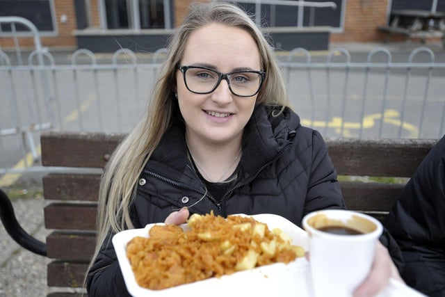 Jessica Armstrong, 26, with a carton of gravy to accompany her fish and chips. 

Picture by FRANK REID