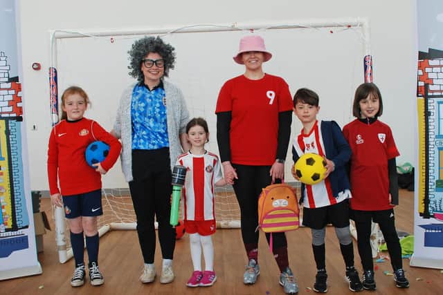 Paige Temperley (left adult) and Ashleigh Lowes (right) with audience members from the first performance of Sweet Caroline and the Football Boots at Hetton Primary School. A big success.