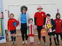 Paige Temperley (left adult) and Ashleigh Lowes (right) with audience members from the first performance of Sweet Caroline and the Football Boots at Hetton Primary School. A big success.