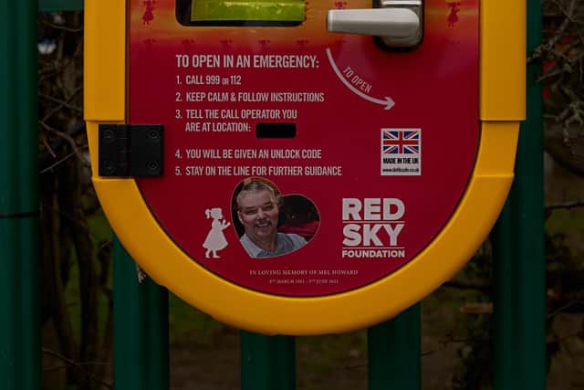 A picture of Mel on the school's new defibrillator