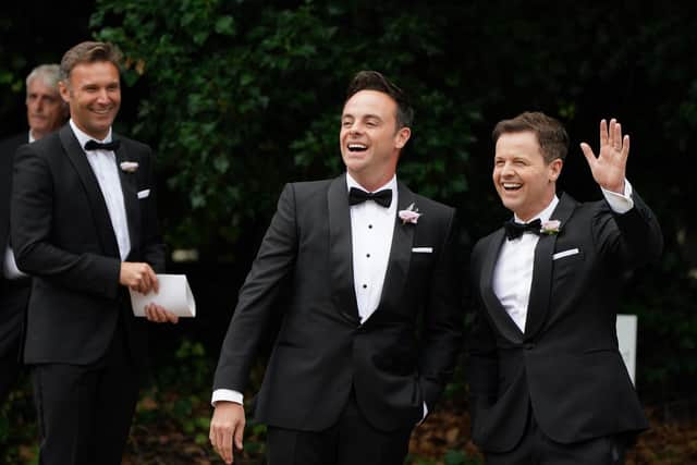 Anthony McPartlin (left) with Declan Donnelly arriving at St Michael's church, Heckfield in Hampshire, for his wedding to Anne-Marie Corbett.