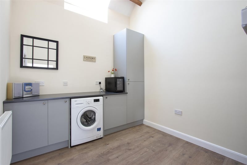 Laundry room with access to the attached annexe.
