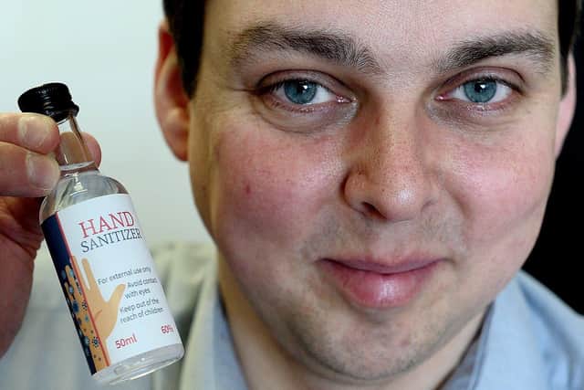 Scott Wilson-Laing, from WL Distillery, with a bottle of hand sanitiser. Picture by FRANK REID