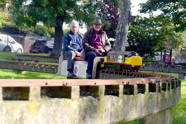 Volunteers Neil Bradshaw and Kenny Allen enjoying a ride on the miniature railway.