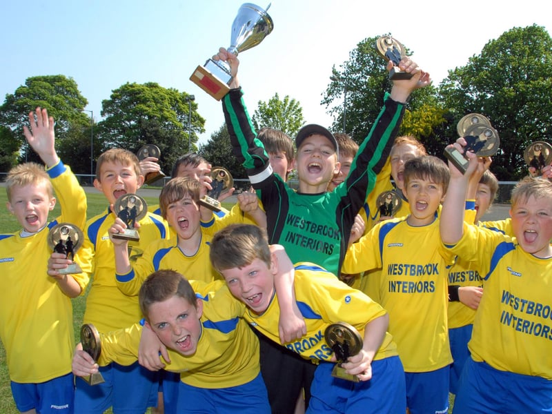 Woodhouse Colts celebrate a 2-1 extra-time win over Robin Hood Colts in the 2013 finals.