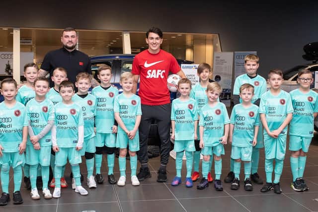 Dan Madden (North East Elite Football Club U10s coach) and Luke O’Nien with members of the under-7 and under-10 teams. Photo: Photo: The Bigger Picture Agency Ltd.