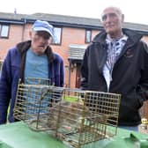 Donnison Gardens residents Paul Reay and Jimmy Smart, right, have been catching rats which are overrun around the area.