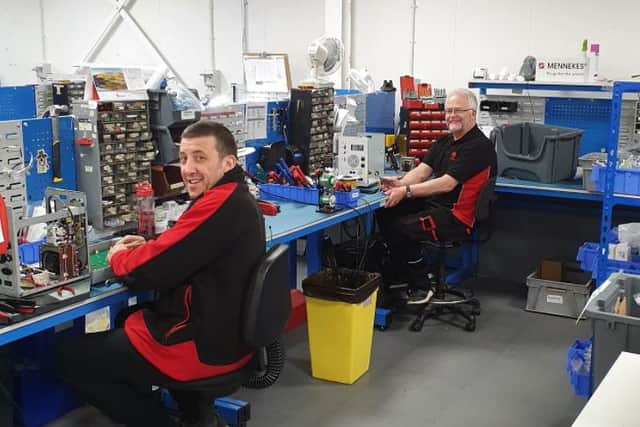 Seaward employees John Harrison and Keith Wood work on manufacturing vital equipment.