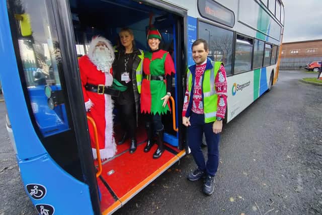 Santa, Nicole Hunt, Big Elf and Stagecoach North East bus driver Craig Hunt.