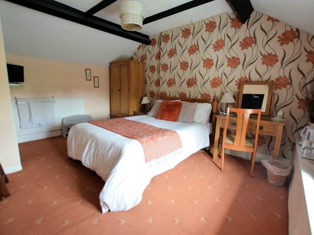 The guest house's family room is a large double room, which can accommodate an additional single bed.