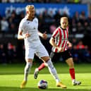 Alex Pritchard and Swansea defender Harry Darling. Picture by FRANK REID