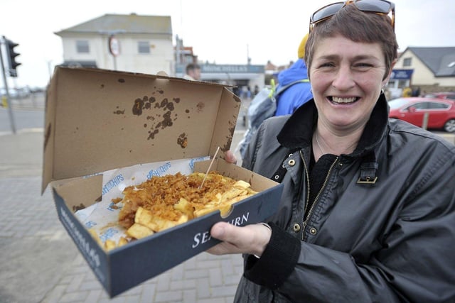 Rosalind Spoors, 50, enjoys a bumper portion of batter on her chips. 

Picture by FRANK REID