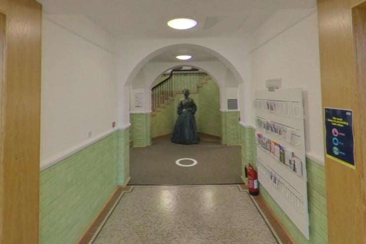 A statue of one of the Pilgrim Fathers setters at the end of a corridor in a section which was once part of the Doncaster Girls High School/