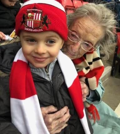 Eva with great-grandson Joseph at his first match aged three.