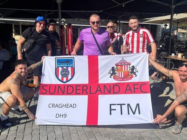 Sunderland AFC supporters from Craghead have their flag at the ready.