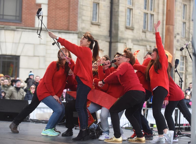 Sunderland University students taking a selfie on stage at their Chinese New Year celebrations in Keel Square in 2019.
