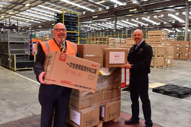 Leader of Sunderland City Council, Councillor Graeme Miller accepts a shipment of PPE masks and goggles from Martin Kendall (right) managing director of Vantec Europe.