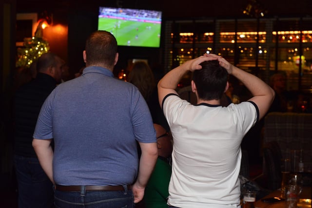 Anxious fans watch as the game slips away from England.