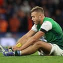 GLASGOW, SCOTLAND - NOVEMBER 21: Ryan Porteous of Hibernian sits injured during the Premier Sports Cup semi-final match between Hibernian and Rangers at Hampden Park on November 21, 2021 in Glasgow, Scotland. (Photo by Ian MacNicol/Getty Images)