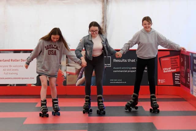 Scarlet Knox, Leah Mills And Faith Harvey join hands during their afternoon at the roller rink., Keel Square, Sunderland . Picture by FRANK REID