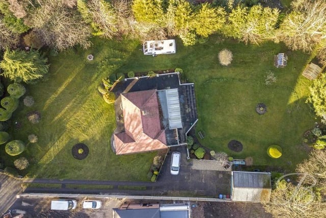 Let's allow the drone to have the last word with this unusual bird's eye view looking directly down on the £400,000 bungalow. Is the property within your budget?