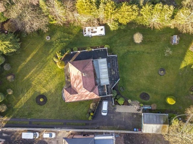 Let's allow the drone to have the last word with this unusual bird's eye view looking directly down on the £400,000 bungalow. Is the property within your budget?