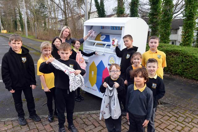 Fatfield Academy Inspires Deputy Headteacher Nicky Dowdle with the school's Eco Warriors at the new clothing recycling station.