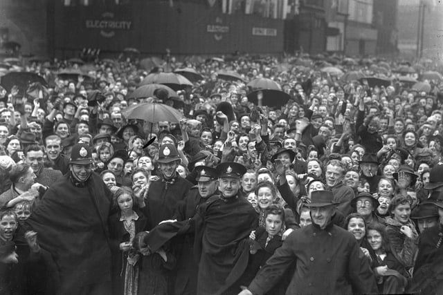 Sunderland people enjoying their VE Day holiday with smiles and cheers for Victory in 1945.