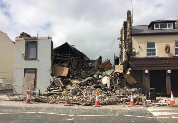 The building pictured after its collapse months on from the blaze, with demolition work then taking place to clear the site.