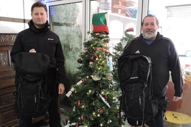 Brian Burridge of North East Homeless (left) and George Clarke at the charity HQ with rucksacks donated by Berghaus.