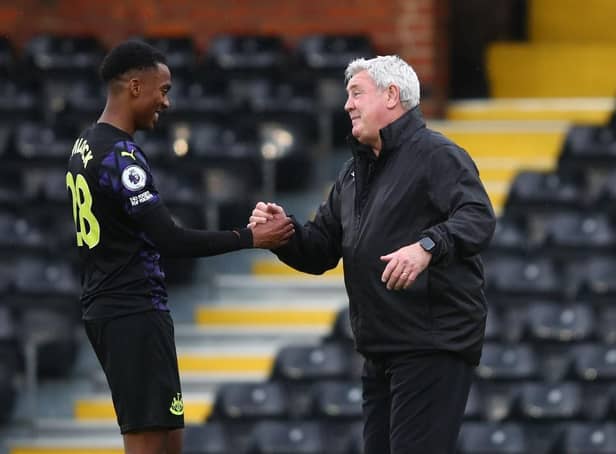 Steve Bruce manager of Newcastle United with Joe Willock after the Premier League match between Fulham and Newcastle United at Craven Cottage on May 23, 2021 in London, United Kingdom.