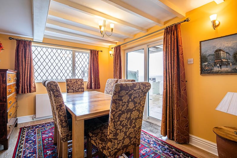 The dining room - linked to the kitchen - is the ideal spot for entertaining or family meals.