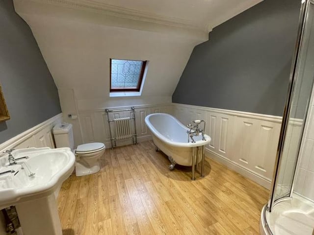 One of the highlights of the Riddings house is this beautiful Victorian-style family bathroom. It's a four-piece suite comprising a slipper-style bath, corner shower enclosure, low-flush WC and pedestal wash hand basin. Notable features are a Velux-style window and an Edwardian-style radiator.
