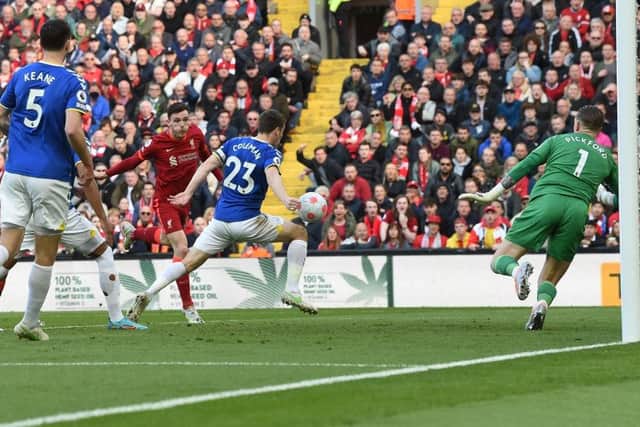 Andy Robertson of Liverpool scores the first goal  during the Premier League match between Liverpool and Everton at Anfield on April 24, 2022 in Liverpool, England. (Photo by John Powell/Liverpool FC via Getty Images)