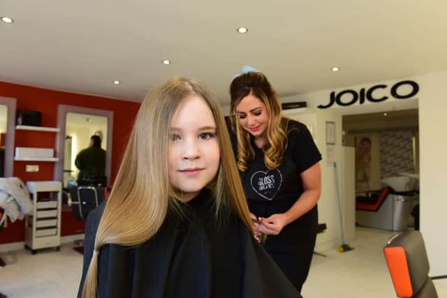 Ella has been raising money for a good cause as well as donating her hair.