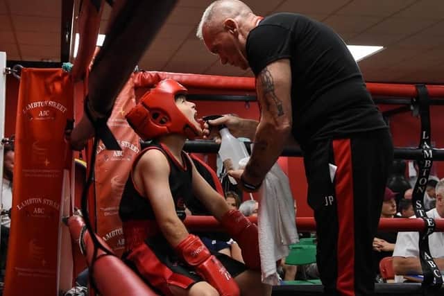 Lambton Street boxing trainer John Pollock, who has lost his life to coronavirus aged 72, seen here doing what he loved best.