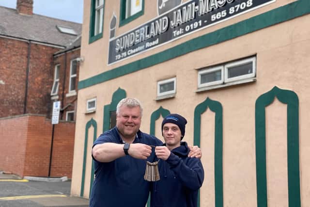 Locksmith Paul Fletcher with his son and colleague Layton outside the Chester Road mosque where he donated his services for free.