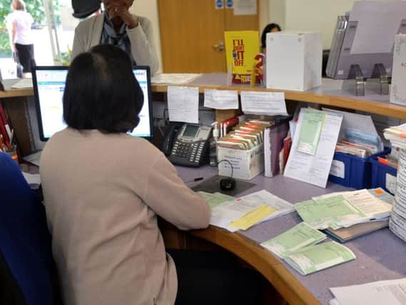 Receptionists could put people off seeing their GP by asking about their symptoms, according to new research. Pic: PA.