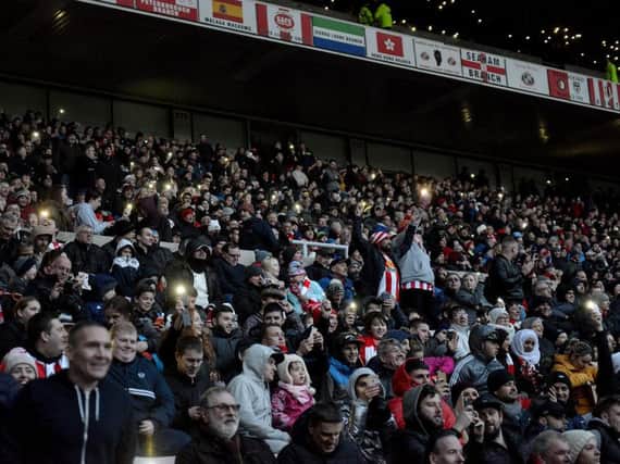 Lights go out at the Stadium of Light - but fans lend a hand with their phones.