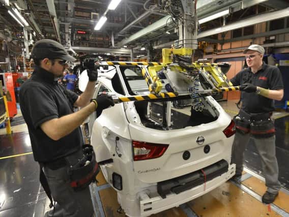 Nissan workers on the production line.