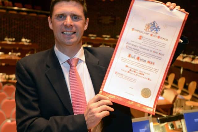 Niall Quinn with his Freedom certificate