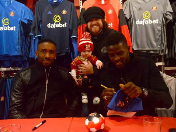 SAFC players Jermain Defoe and Papy Djilobodji fan signing. Matthew Stoker with son Hendrix Stoker aged 9 months.