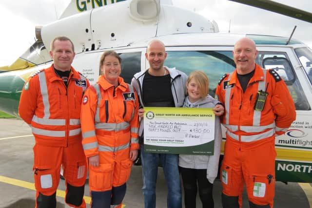 Paul Parker and daughter Aimee with pilot Owen McTeggart, Dr Jo Paterson and paramedic Terry Sharpe